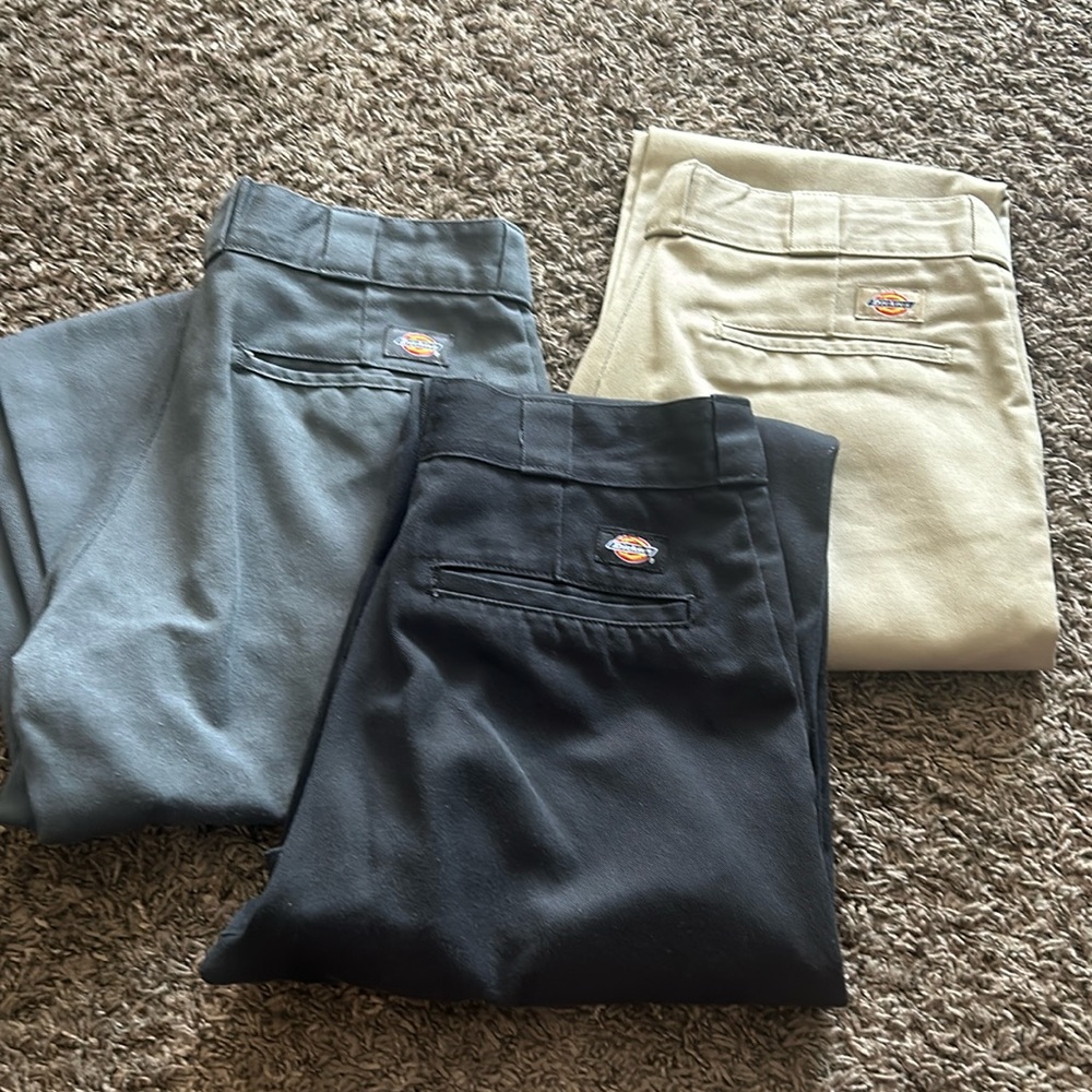 3 pairs of dickie pants. Tan worn one time. Black and gray worn a couple times.